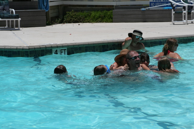 2010-07-05-Port-Aransas-075-Travis-Chance-Dax-pool-wrestling-kids.JPG