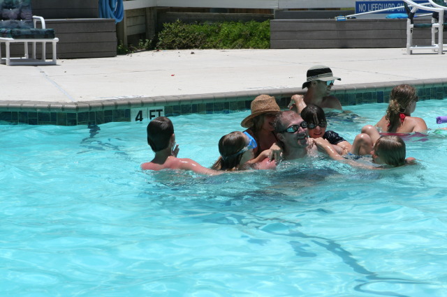 2010-07-05-Port-Aransas-078-Travis-Chance-Dax-pool-wrestling-kids.JPG