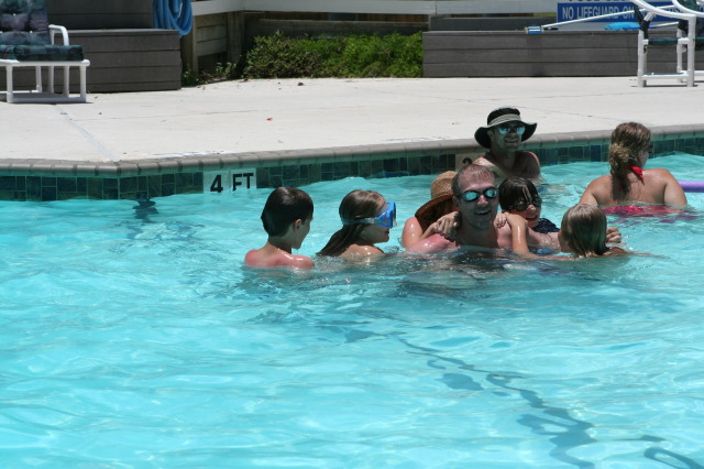 2010-07-05-Port-Aransas-079-Travis-Chance-Dax-pool-wrestling-kids.JPG