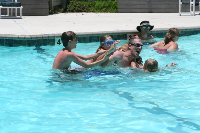2010-07-05-Port-Aransas-088-Travis-Chance-Dax-pool-wrestling-kids.JPG