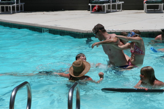 2010-07-05-Port-Aransas-101-Travis-Chance-Dax-pool-wrestling-kids.JPG