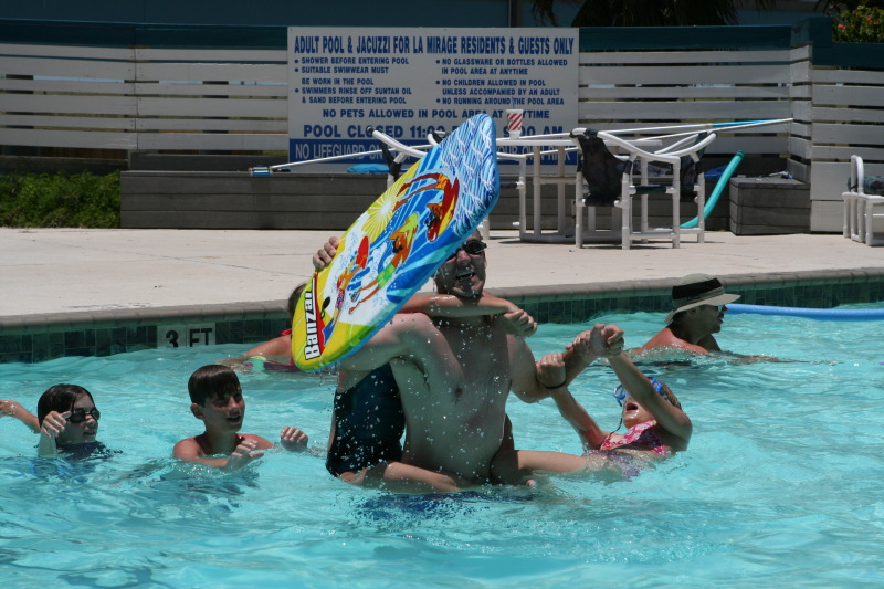 2010-07-05-Port-Aransas-041-Travis-Chance-Dax-pool-wrestling-kids.JPG