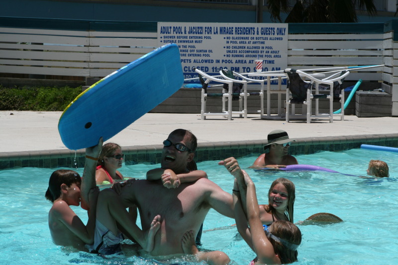 2010-07-05-Port-Aransas-054-Travis-Chance-Dax-pool-wrestling-kids.JPG