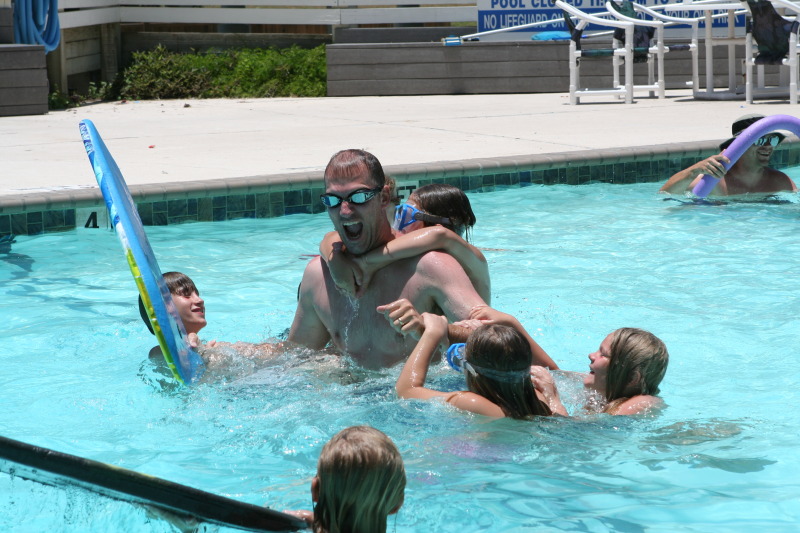 2010-07-05-Port-Aransas-060-Travis-Chance-Dax-pool-wrestling-kids.JPG