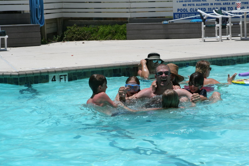 2010-07-05-Port-Aransas-069-Travis-Chance-Dax-pool-wrestling-kids.JPG