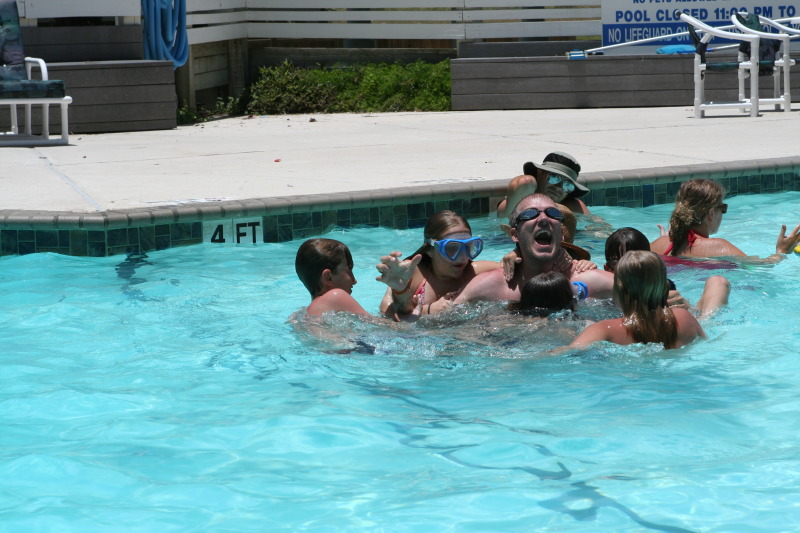 2010-07-05-Port-Aransas-071-Travis-Chance-Dax-pool-wrestling-kids.JPG