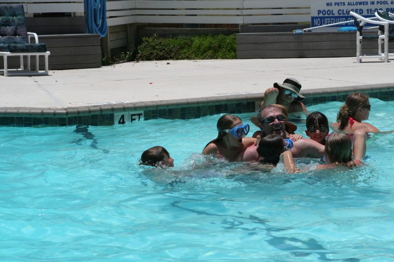 2010-07-05-Port-Aransas-072-Travis-Chance-Dax-pool-wrestling-kids.JPG