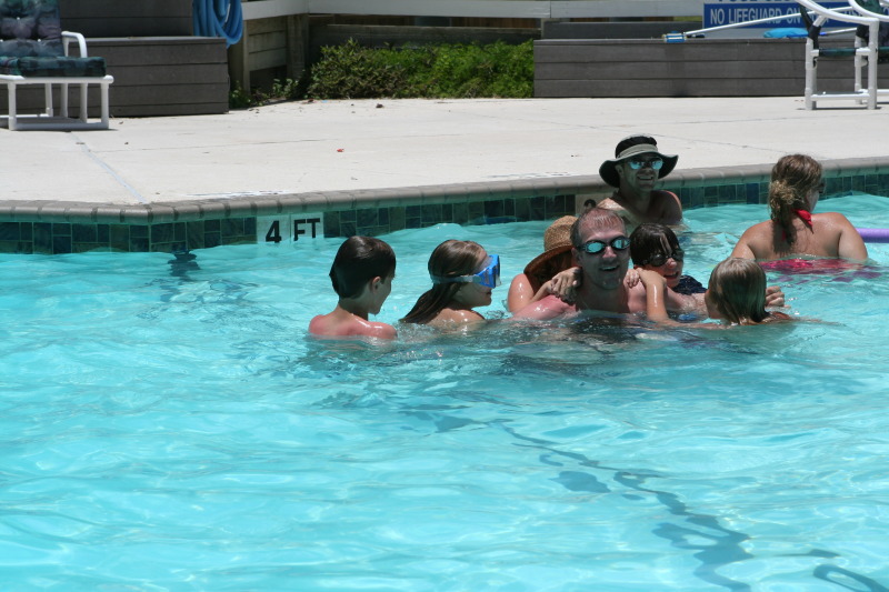 2010-07-05-Port-Aransas-079-Travis-Chance-Dax-pool-wrestling-kids.JPG