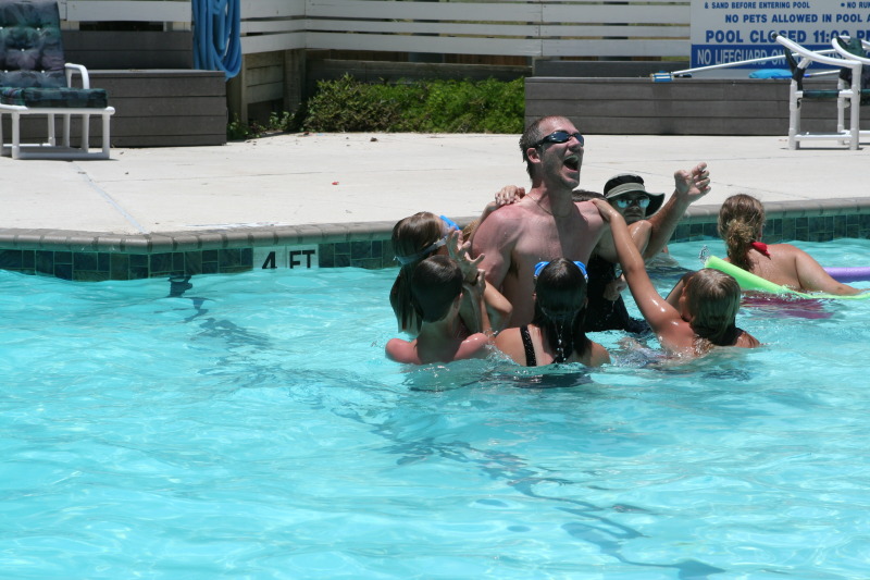 2010-07-05-Port-Aransas-083-Travis-Chance-Dax-pool-wrestling-kids.JPG