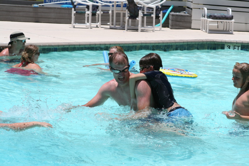 2010-07-05-Port-Aransas-094-Travis-Chance-Dax-pool-wrestling-kids.JPG