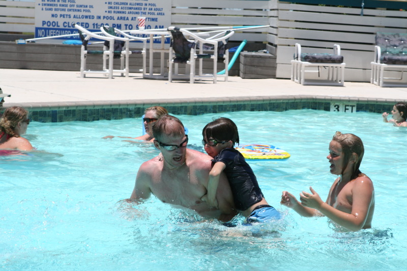 2010-07-05-Port-Aransas-095-Travis-Chance-Dax-pool-wrestling-kids.JPG