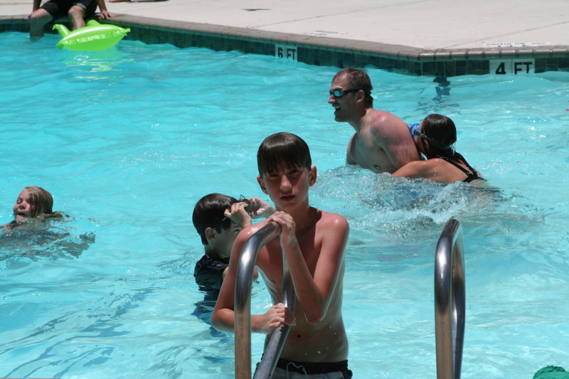2010-07-05-Port-Aransas-098-Travis-Chance-Dax-pool-wrestling-kids.JPG