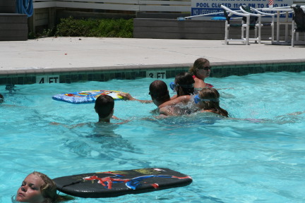 2010-07-05-Port-Aransas-038-Travis-Chance-Dax-pool-wrestling-kids.JPG