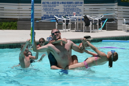 2010-07-05-Port-Aransas-043-Travis-Chance-Dax-pool-wrestling-kids.JPG