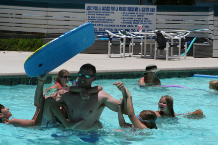 2010-07-05-Port-Aransas-052-Travis-Chance-Dax-pool-wrestling-kids.JPG