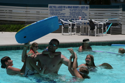 2010-07-05-Port-Aransas-053-Travis-Chance-Dax-pool-wrestling-kids.JPG