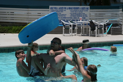 2010-07-05-Port-Aransas-055-Travis-Chance-Dax-pool-wrestling-kids.JPG