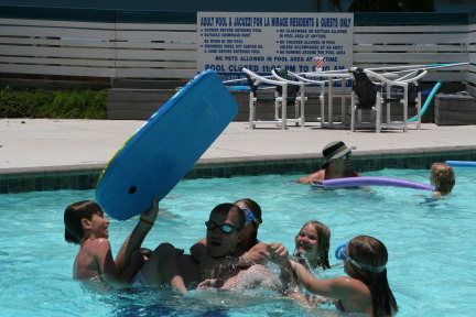 2010-07-05-Port-Aransas-056-Travis-Chance-Dax-pool-wrestling-kids.JPG