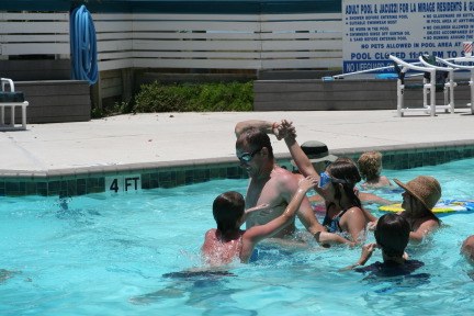 2010-07-05-Port-Aransas-063-Travis-Chance-Dax-pool-wrestling-kids.JPG