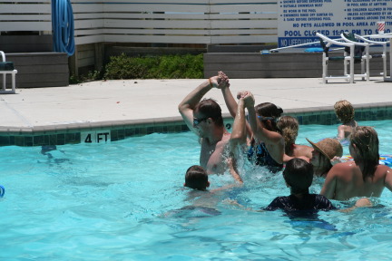 2010-07-05-Port-Aransas-065-Travis-Chance-Dax-pool-wrestling-kids.JPG