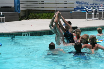 2010-07-05-Port-Aransas-066-Travis-Chance-Dax-pool-wrestling-kids.JPG