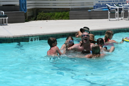 2010-07-05-Port-Aransas-070-Travis-Chance-Dax-pool-wrestling-kids.JPG