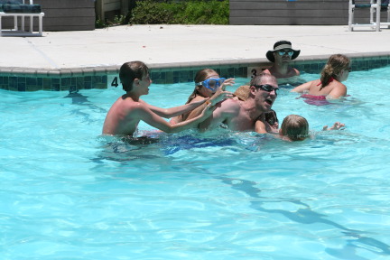 2010-07-05-Port-Aransas-088-Travis-Chance-Dax-pool-wrestling-kids.JPG