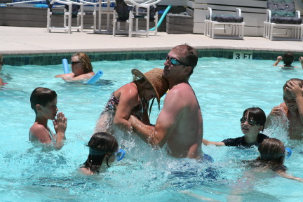 2010-07-05-Port-Aransas-089-Travis-Chance-Dax-pool-wrestling-kids.JPG
