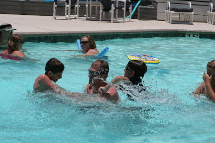 2010-07-05-Port-Aransas-092-Travis-Chance-Dax-pool-wrestling-kids.JPG