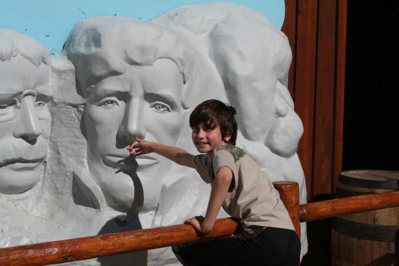 2011-10-05-SD-Wall-Drug-11-Dax-picking-Lincolns-nose-GOOD.JPG
