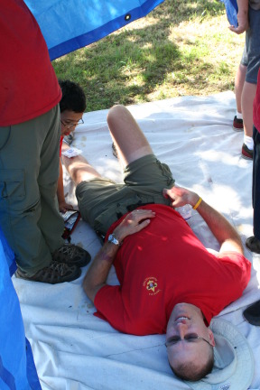 2012-03-31-Troop214-District-Camporee-Wolf-Mountain-56-Playtpi-killing-Travis-first-aid-victim-GOOD.JPG