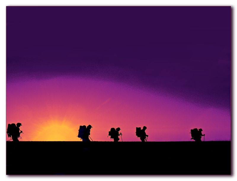Silhouettehikerscolourfulsunrise.jpg