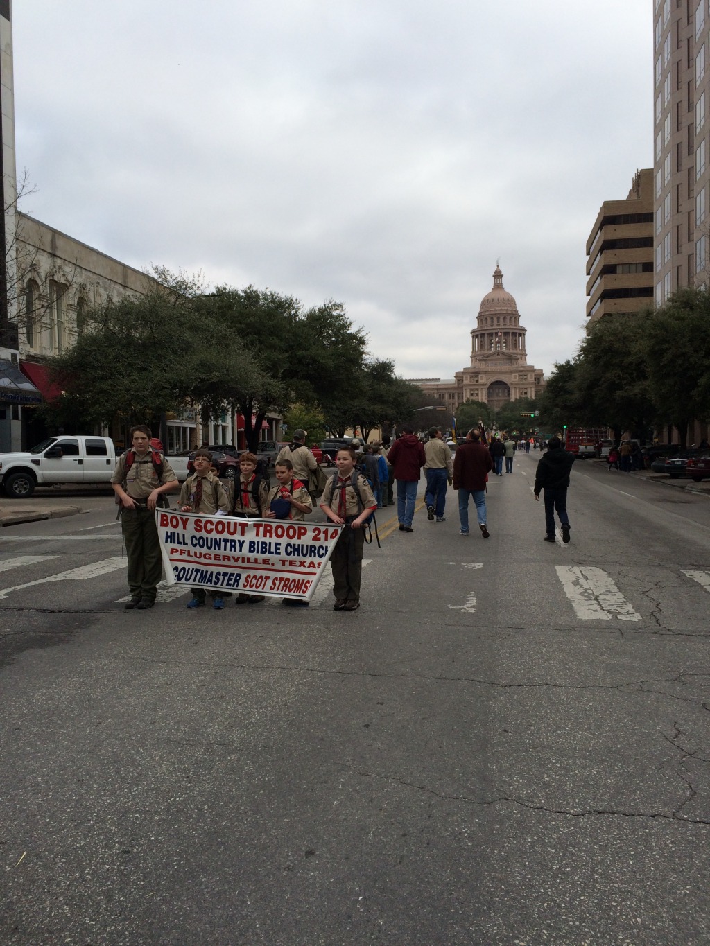 2015/02(February)/Troop214-Report-to-State/1024x768_2015-02-07-Troop214-Report-to-State-Parade-18-Case-ConnorH-ConnorM-Aiden-Zach.JPG