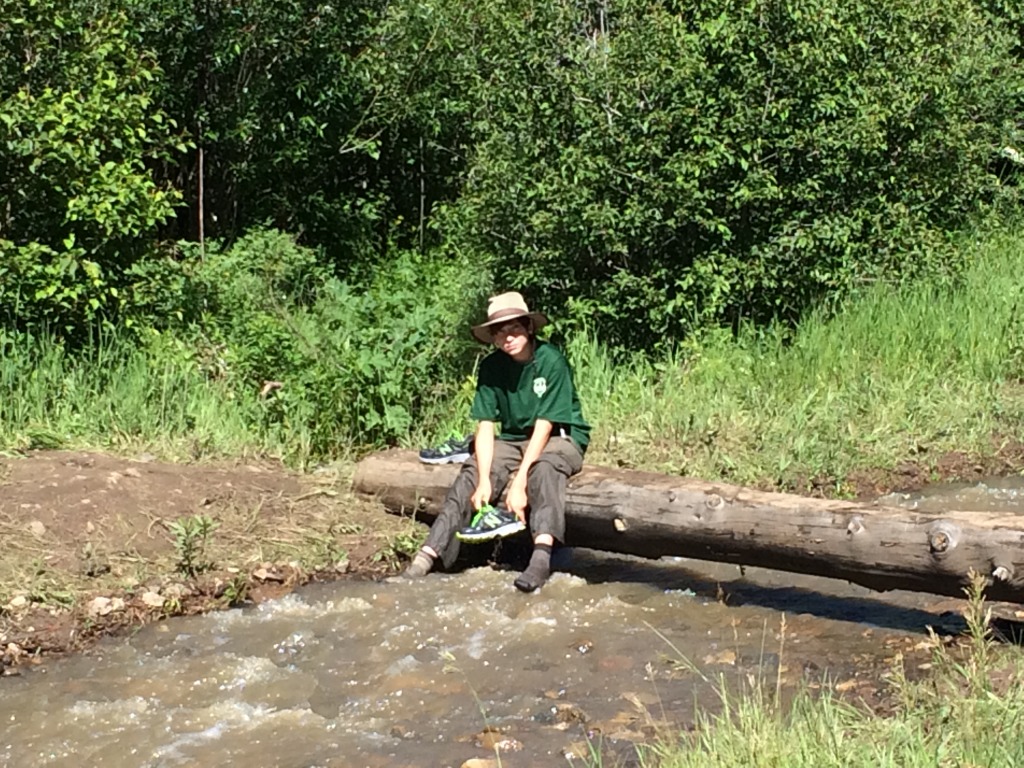 2015-07-09-Philmont-5star-007-wet-hike-to-Ponil-Dax-cleaning-shoes.jpg