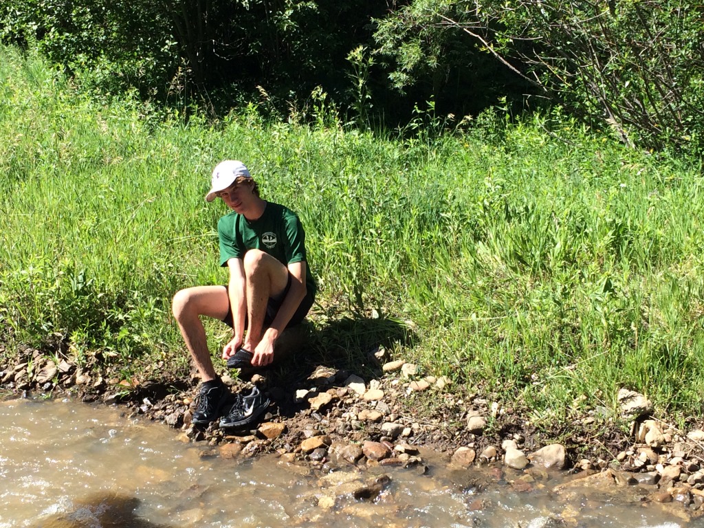 2015-07-09-Philmont-5star-008-wet-hike-to-Ponil-Chance-cleaning-shoes.jpg