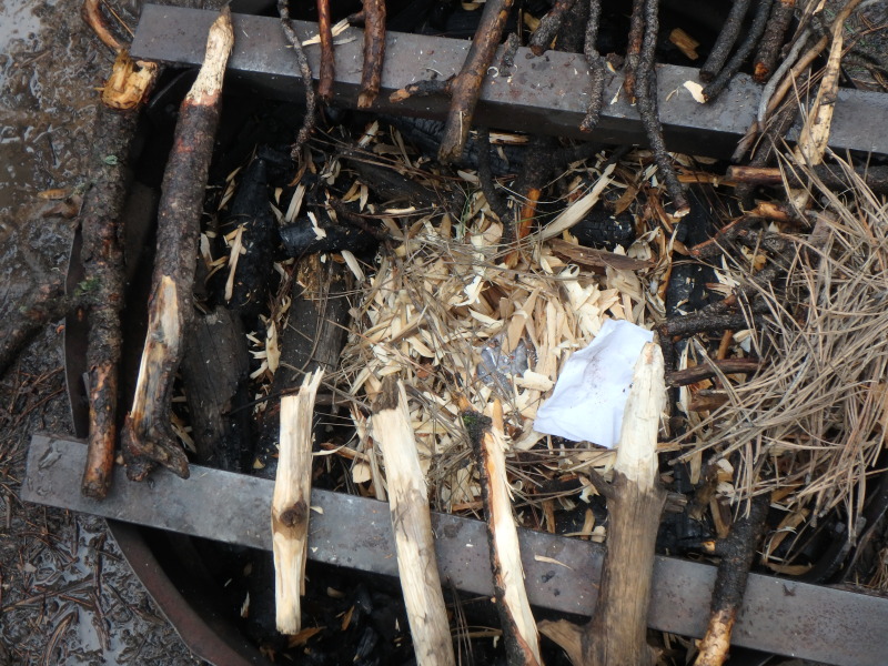 2015-07-06-Philmont-5star-013-Santa-Claus-trying-to-start-a-fire-with-wet-wood.jpg