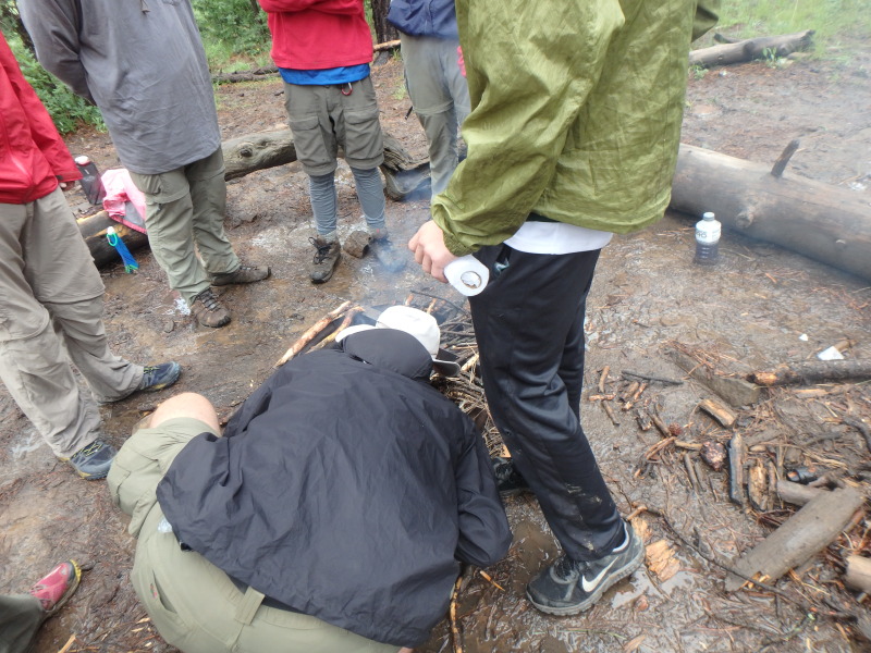 2015-07-06-Philmont-5star-014-Santa-Claus-trying-to-start-a-fire-with-wet-wood-Travis-nick-named-BlowTorch-for-90-minutes-of-blowing-on-the-fire.jpg