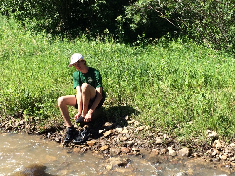 2015-07-09-Philmont-5star-008-wet-hike-to-Ponil-Chance-cleaning-shoes.jpg