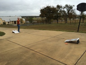 2015-11-26-Thanksgiving-Adriana-visit-08-Travis-cornhole.JPG