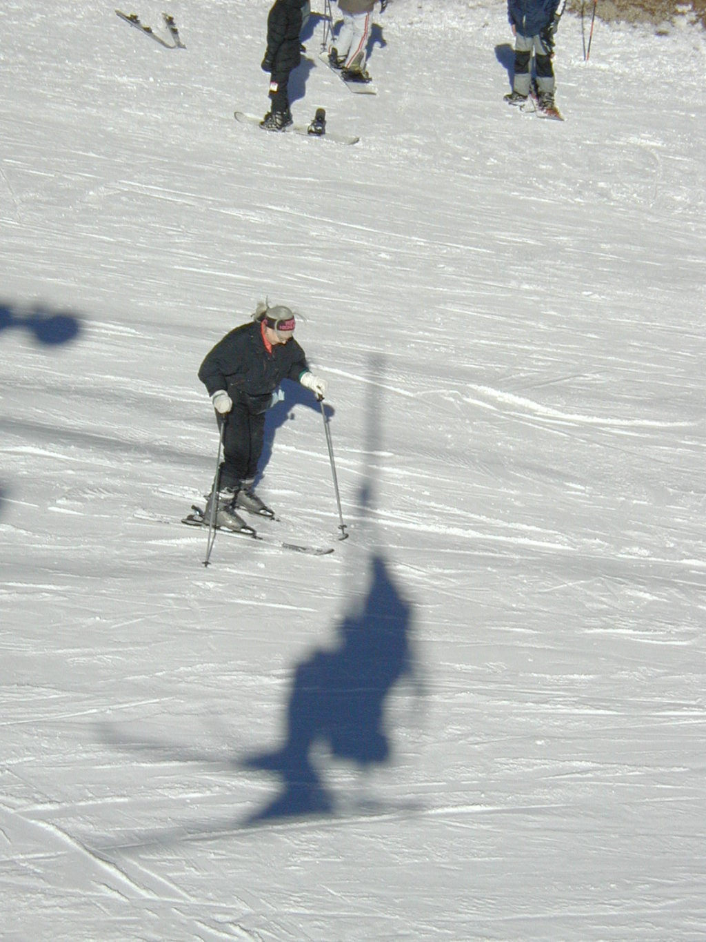 2017/01(January)/Grammy/1024x768_2004-01-19-Ruidoso-18-Grammy-skiing-Travis-Chance-shadow-on-chairlift.JPG