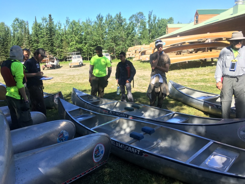 2018-06-13-Northern-Tier-Crew8787-01-Dax-Eric-Phillip-Chance-Carl-picking-canoes.JPG