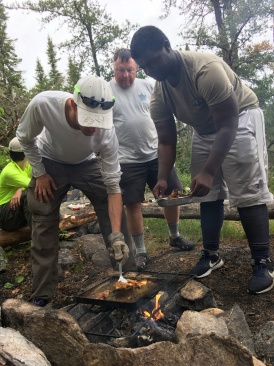2018-06-16-Northern-Tier-Crew8787-16-Chance-Bob-Eric-grilling-fish.JPG
