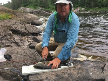 2018-06-19-Northern-Tier-Crew8787-11-Bob-cleaning-fish.JPG