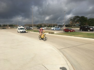 2018-06-29-TAMU-orientation-1-Chance-Suzi-yellow-bike.JPG