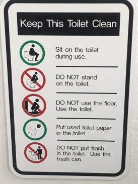 2019-07-13-50th-anniversary-cruise-Anchorage-15-funny-toilet-sign.JPG