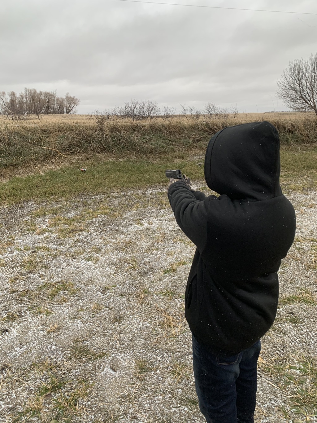 2019/11(November)/SD-Pheasant-Hunting/1024x768_2019-11-10-SD-Pheasant-Hunting-06-Jake-9mm-pistol.JPG