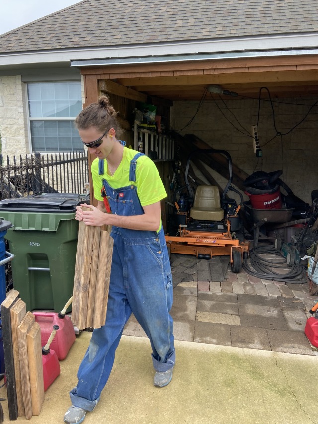 2020-04-05-Chance-mowing-overalls.JPG