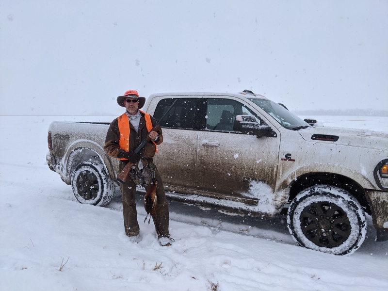 2020/11(November)/Hunting-South-Dakota/800x600_2020-11-10-SD-Hunting-08-snow-Travis-bird-truck.JPG