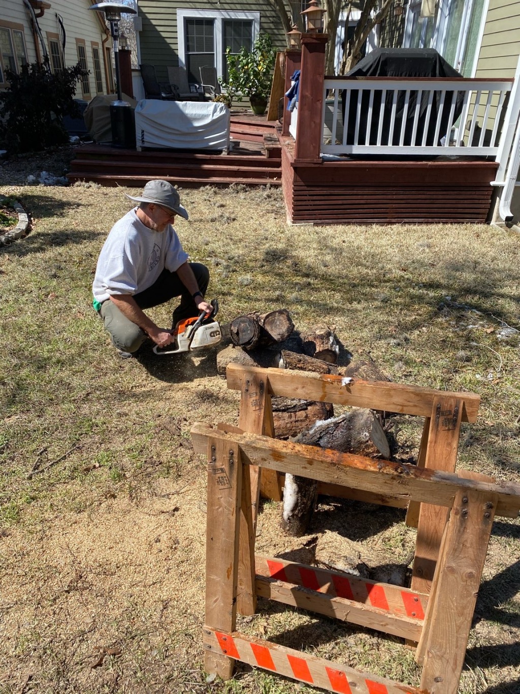 2021-02-27--Texas-Ice-Storm-1-Travis-Cutting-wood-with-Chainsaw.JPG