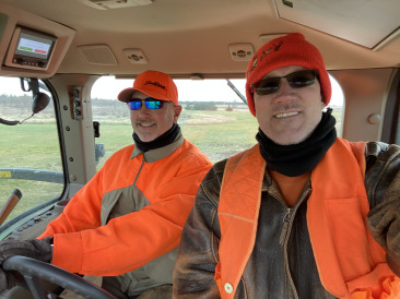 2021-11-11-South-Dakota-Hunting-05-Mike-Travis-driving-Tractor.jpg